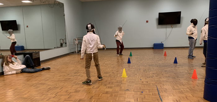 Sabre fencers use en garde position